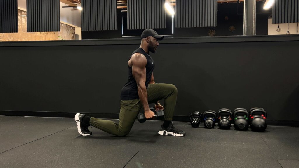 Strength training with dumbbells in a Denver gym.