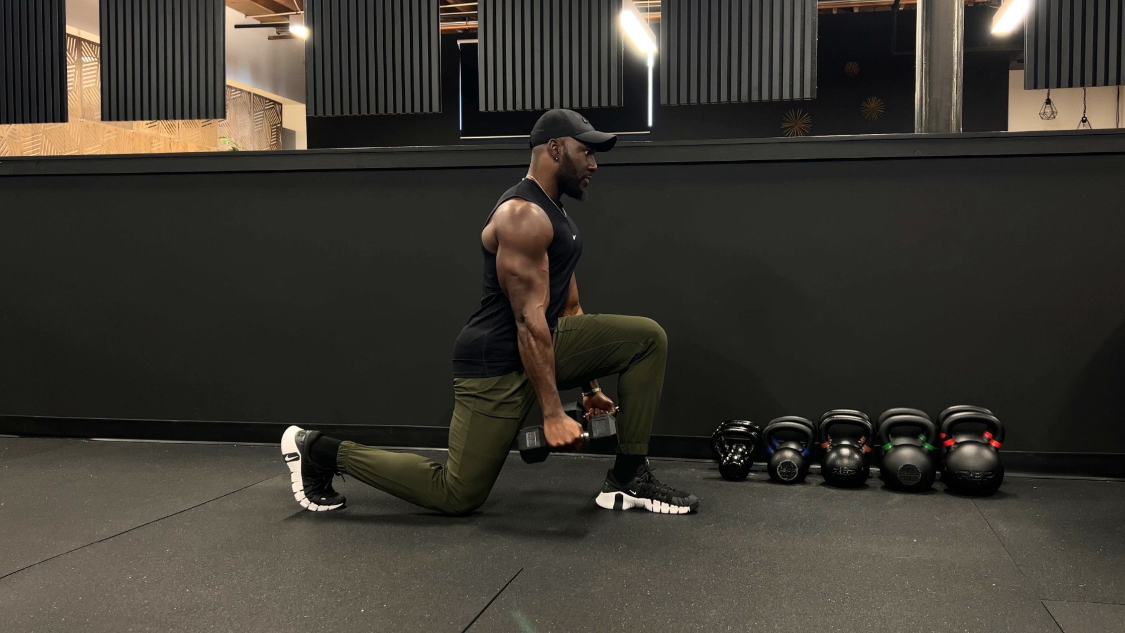 Strength training with dumbbells in a Denver gym.