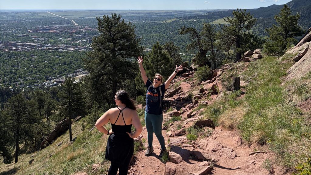 People enjoying an outdoor hike overlooking Denver, Colorado