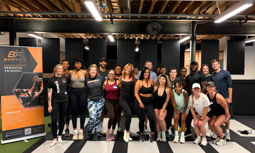 Group picture of attendees after fitness and health activities at the Vital360 wellness event in Denver.